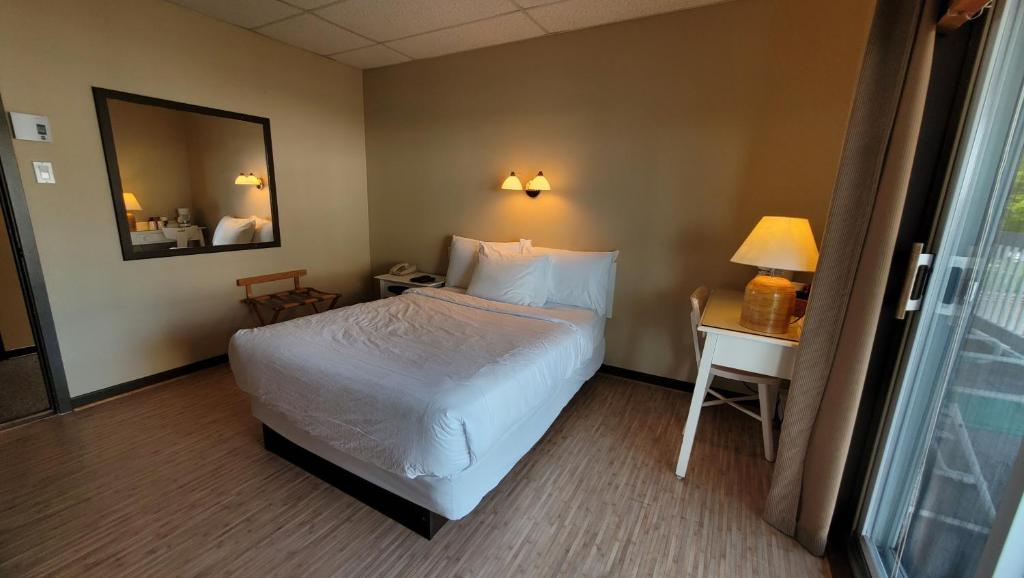 Postel nebo postele na pokoji v ubytování Hôtel Aquamer