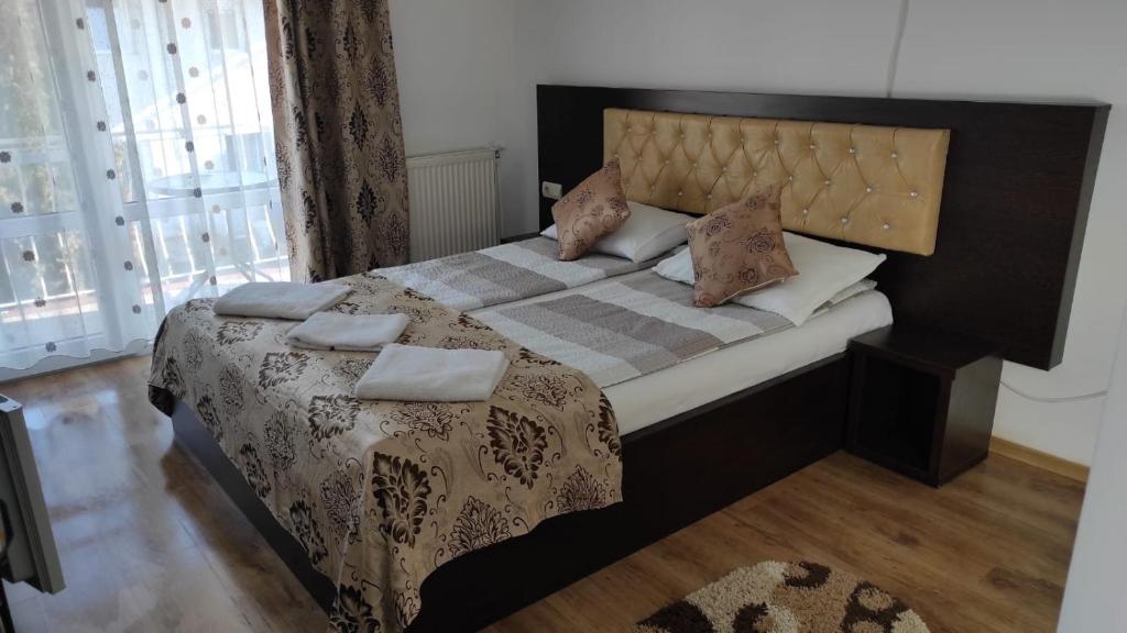 Postel nebo postele na pokoji v ubytování Vila Ariana