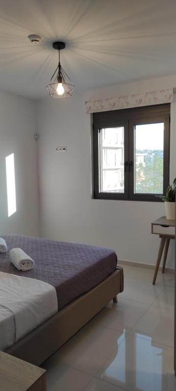EZITH LUXURY APARTMENTSにあるベッド
