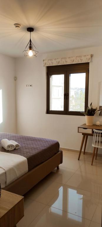 EZITH LUXURY APARTMENTSにあるベッド