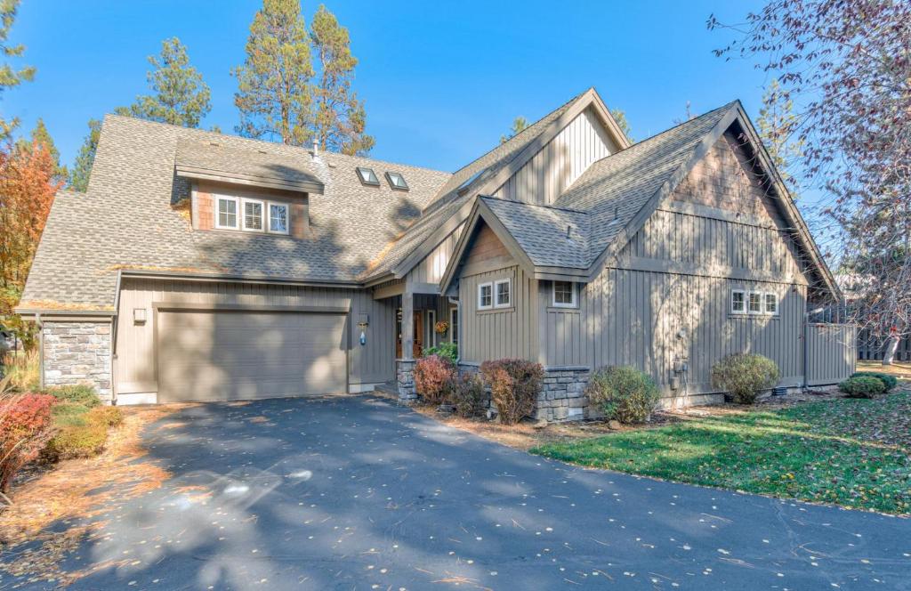 a large house with a garage at Aquila Lodge - Unit 5 in Sunriver
