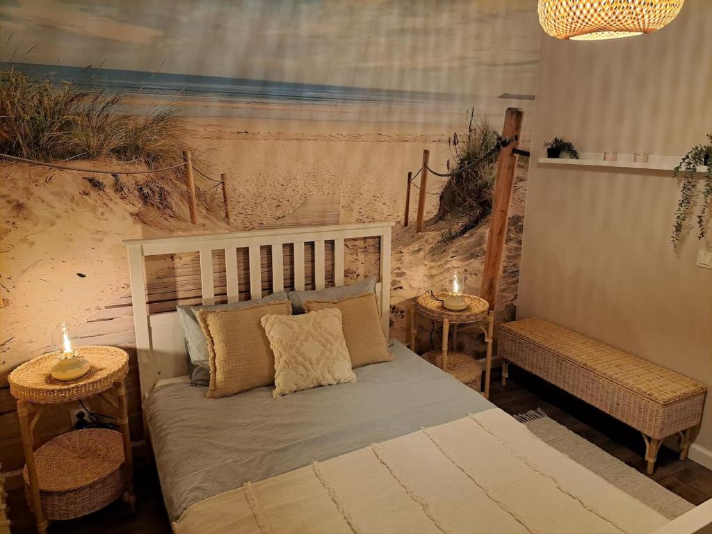 a bedroom with a bed and two tables with candles at Willa la Maddalena apartament in Unieście