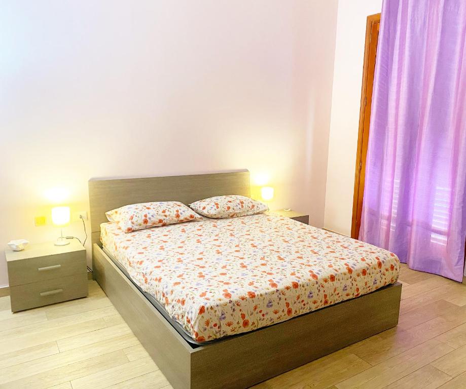 A bed or beds in a room at La Casa Di Rosa