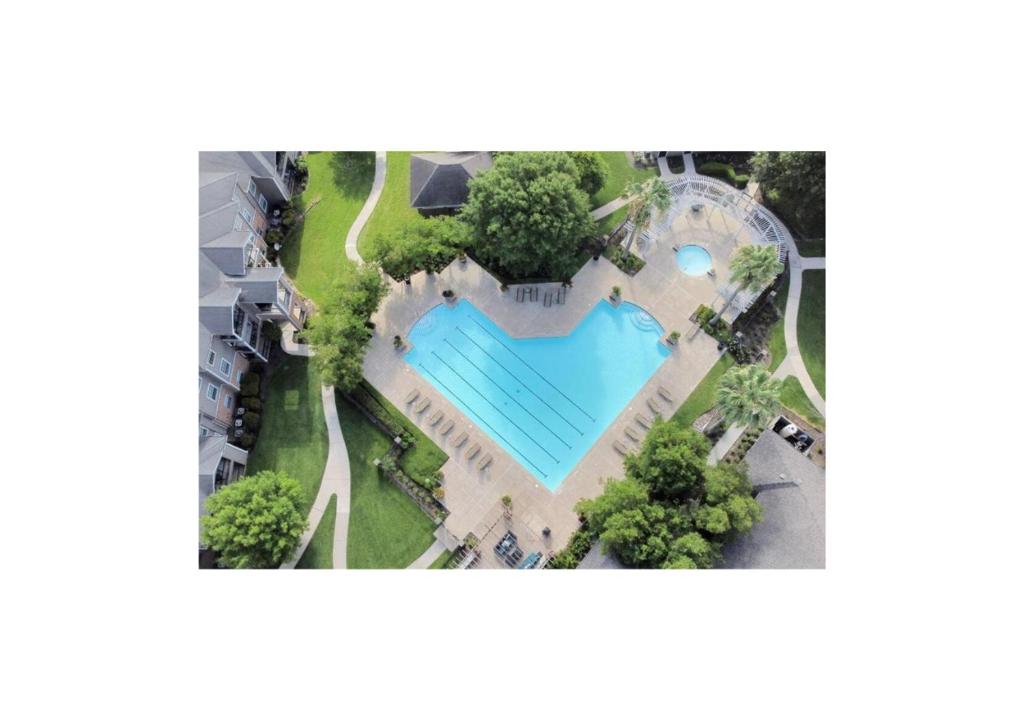 an overhead view of a heart shaped pool at a resort at Luxury 2 Bedroom Apartment with Balcony at Heights - Sleeps 4 in Houston