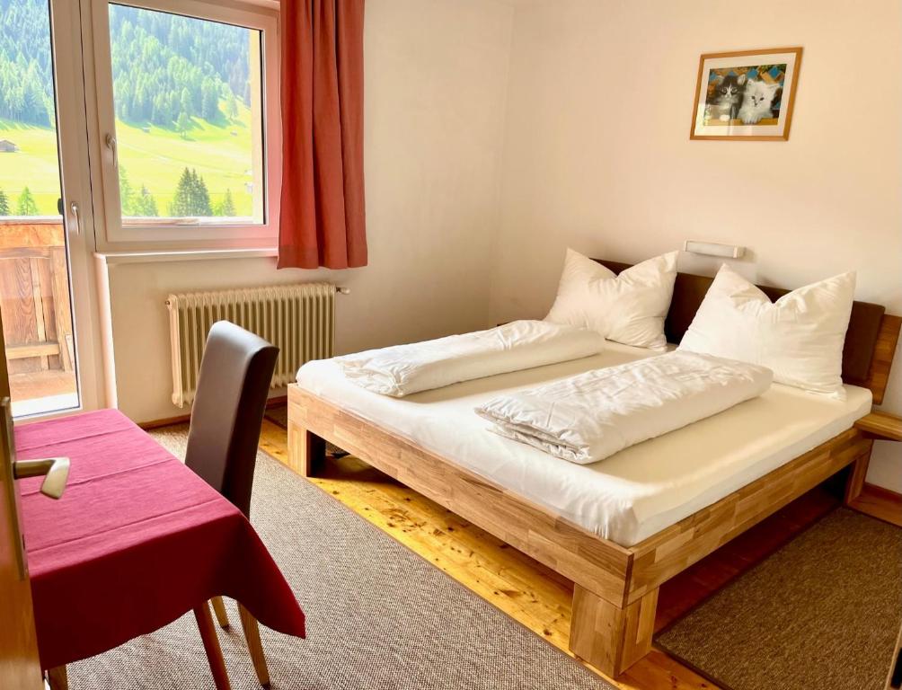 a bedroom with two beds and a window at Pranger Hof in Trins