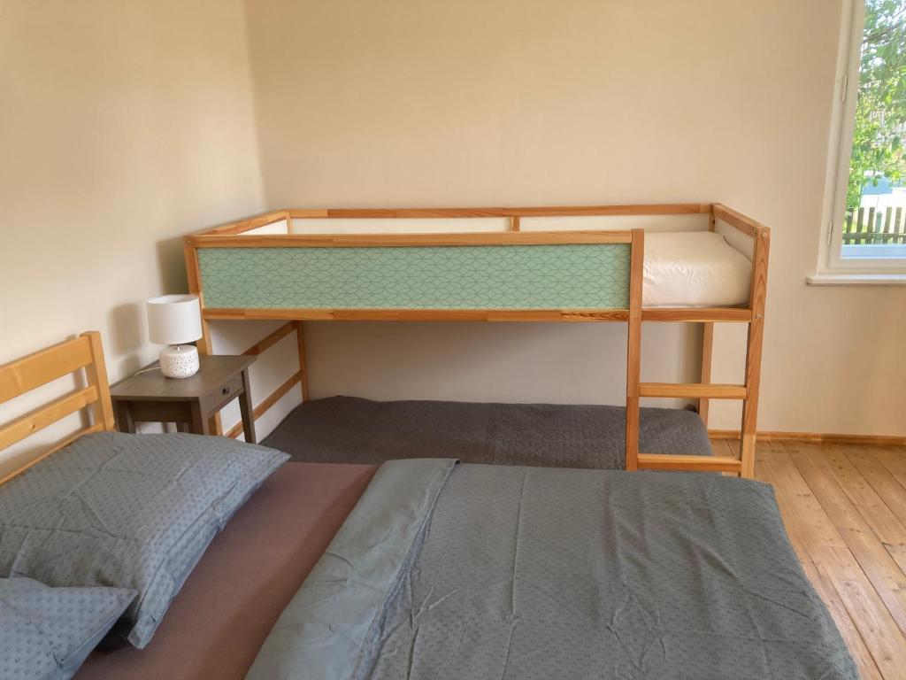 Postel nebo postele na pokoji v ubytování Apartmány Chmelničky