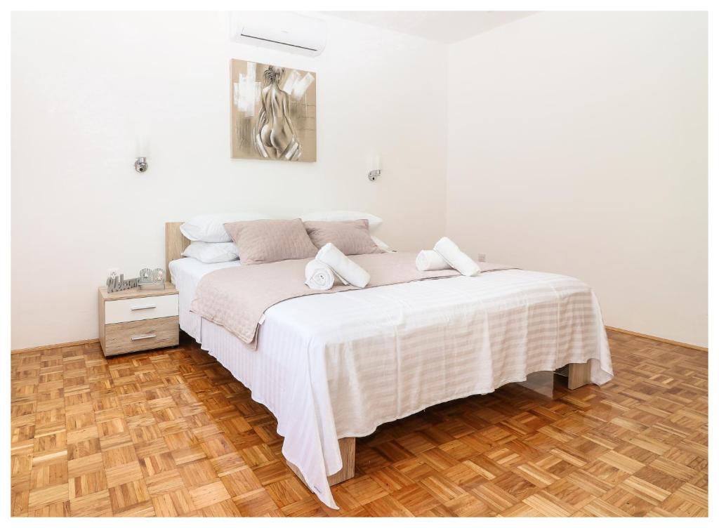 Postel nebo postele na pokoji v ubytování Apartment Legend