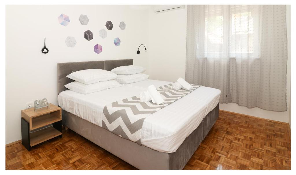 Postel nebo postele na pokoji v ubytování Apartment Legend