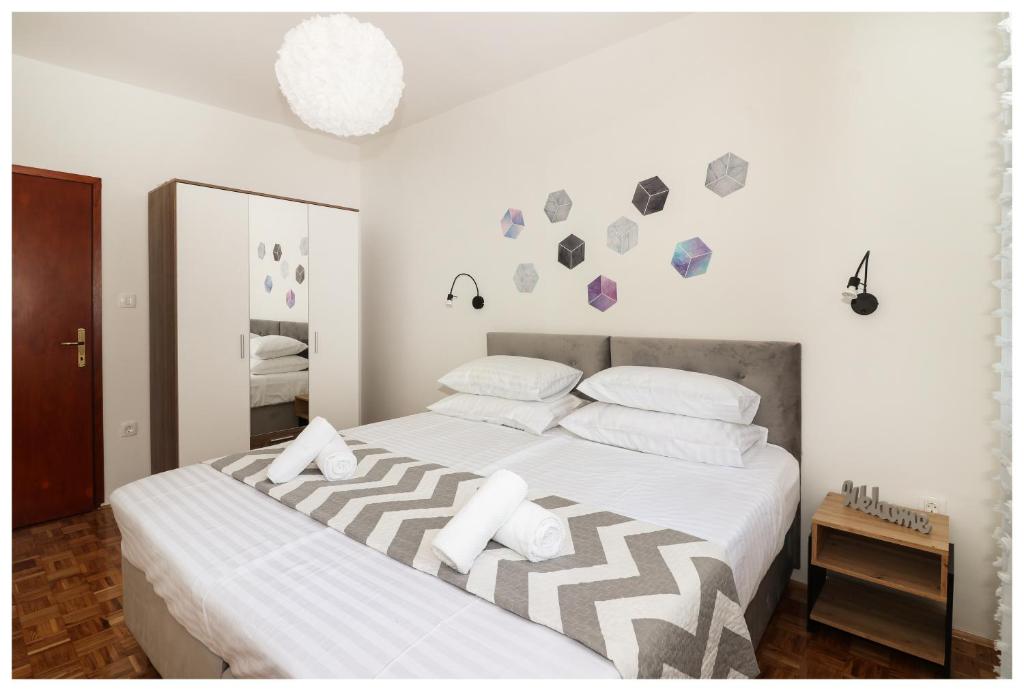 Postel nebo postele na pokoji v ubytování Apartment Legend