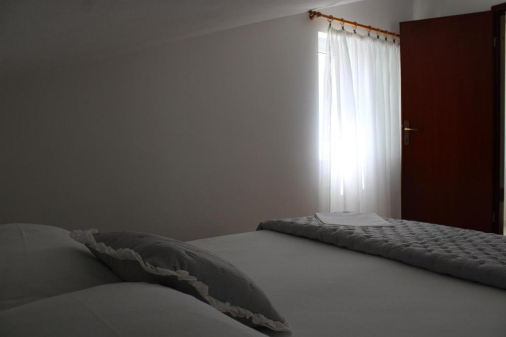 Postel nebo postele na pokoji v ubytování Apartments & Rooms Anita