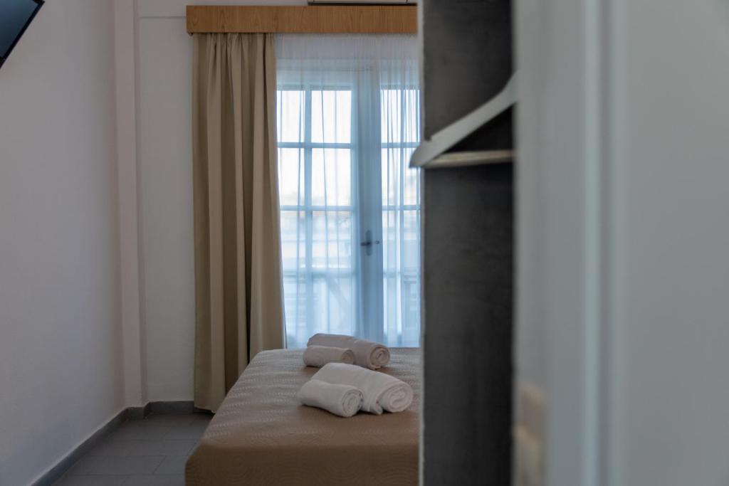 Postel nebo postele na pokoji v ubytování Astri Hotel