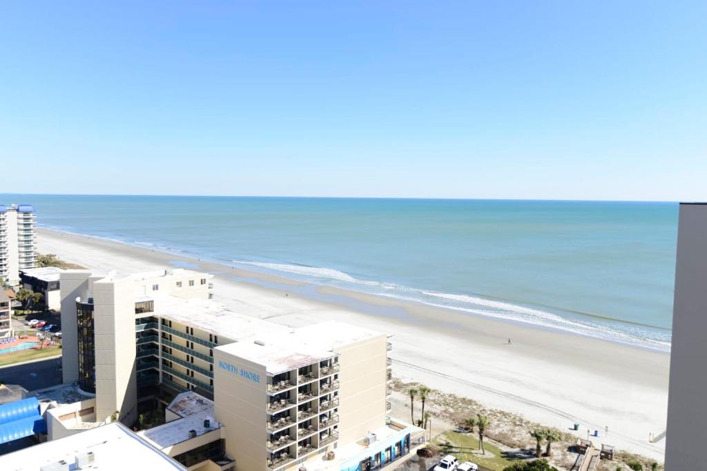 an aerial view of the beach and buildings at Paradise Ocean View at Top Resort w Lazy River in Myrtle Beach