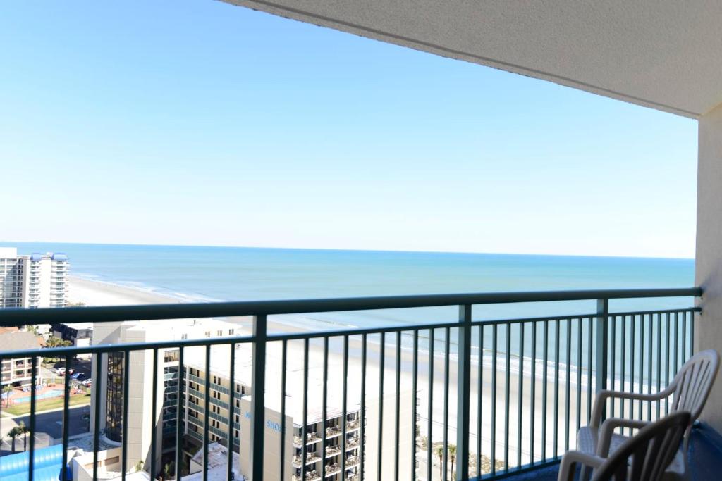 a balcony with a view of the beach and the ocean at Paradise Ocean View at Top Resort w Lazy River in Myrtle Beach