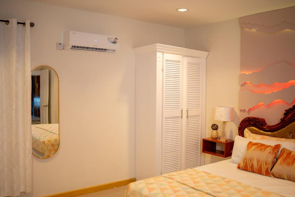Кровать или кровати в номере Escappé Suites