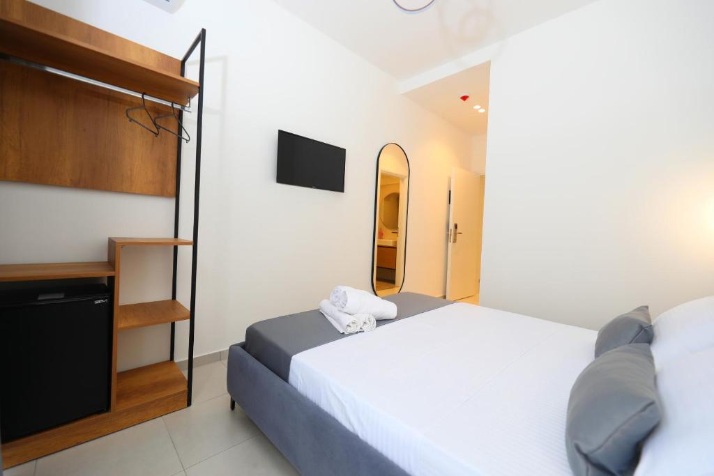 Postel nebo postele na pokoji v ubytování Maor Hotel