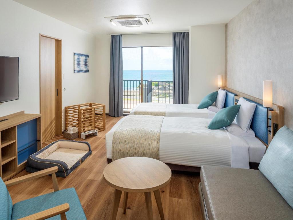 Postel nebo postele na pokoji v ubytování Atagawa Ocean Resort