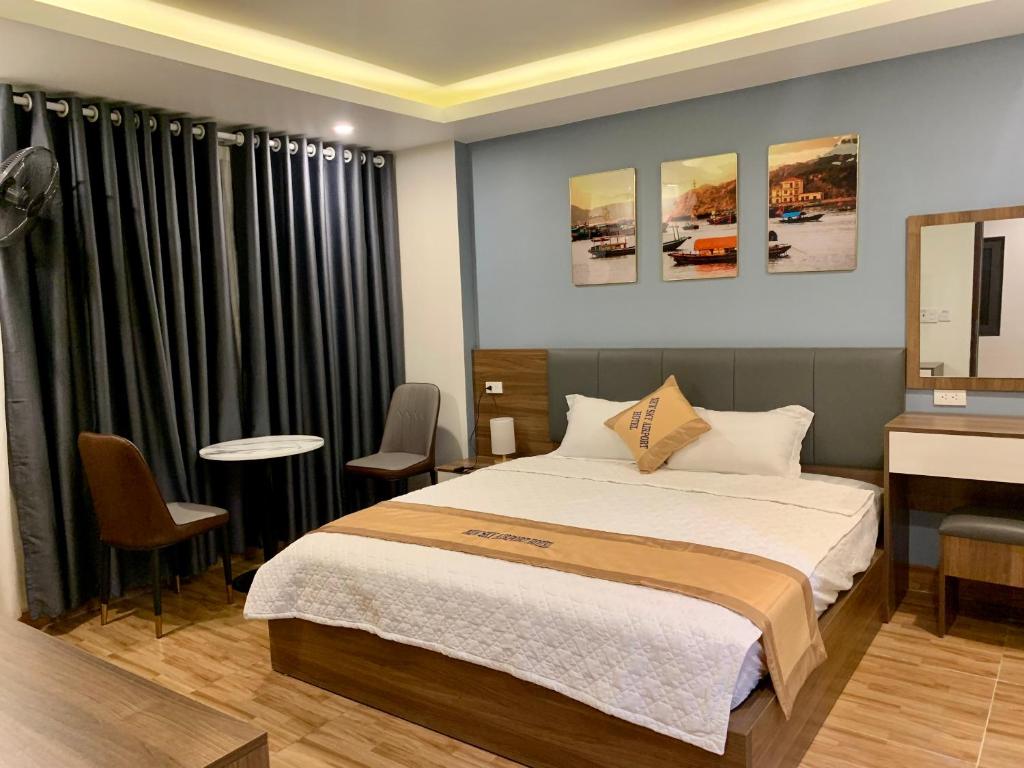 Postel nebo postele na pokoji v ubytování NEW SKY AIRPORT HOTEL NỘI BÀI