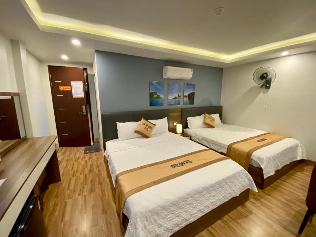 Postel nebo postele na pokoji v ubytování NEW SKY AIRPORT HOTEL NỘI BÀI