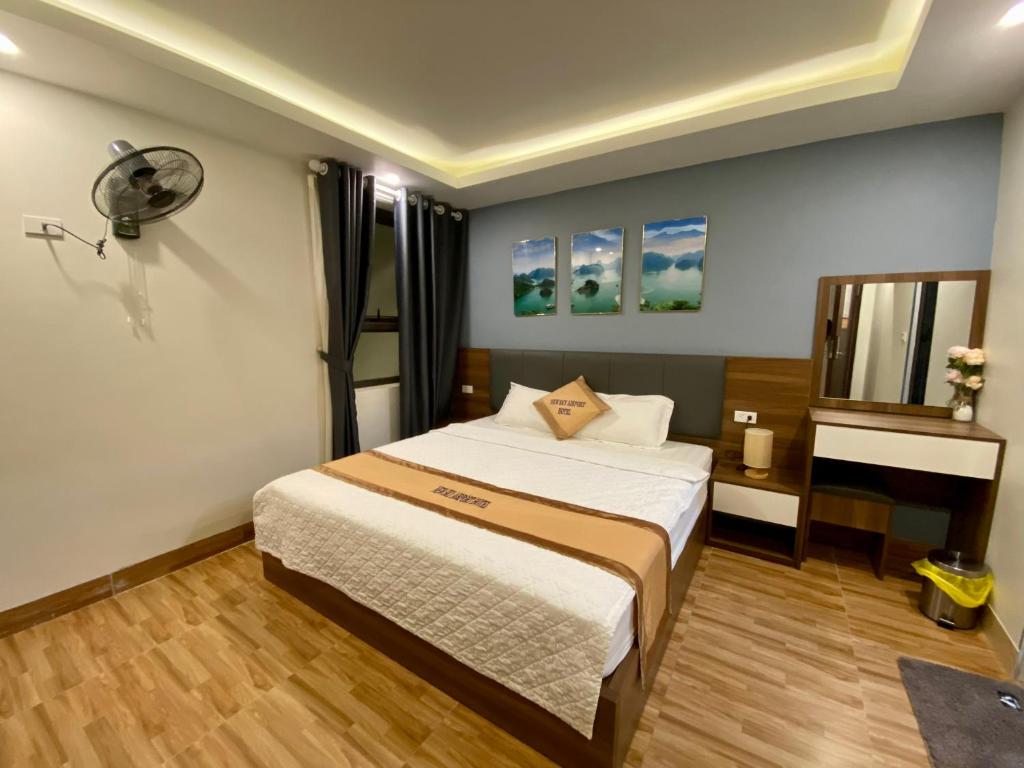 Postel nebo postele na pokoji v ubytování NEW SKY AIRPORT HOTEL NỘI BÀI