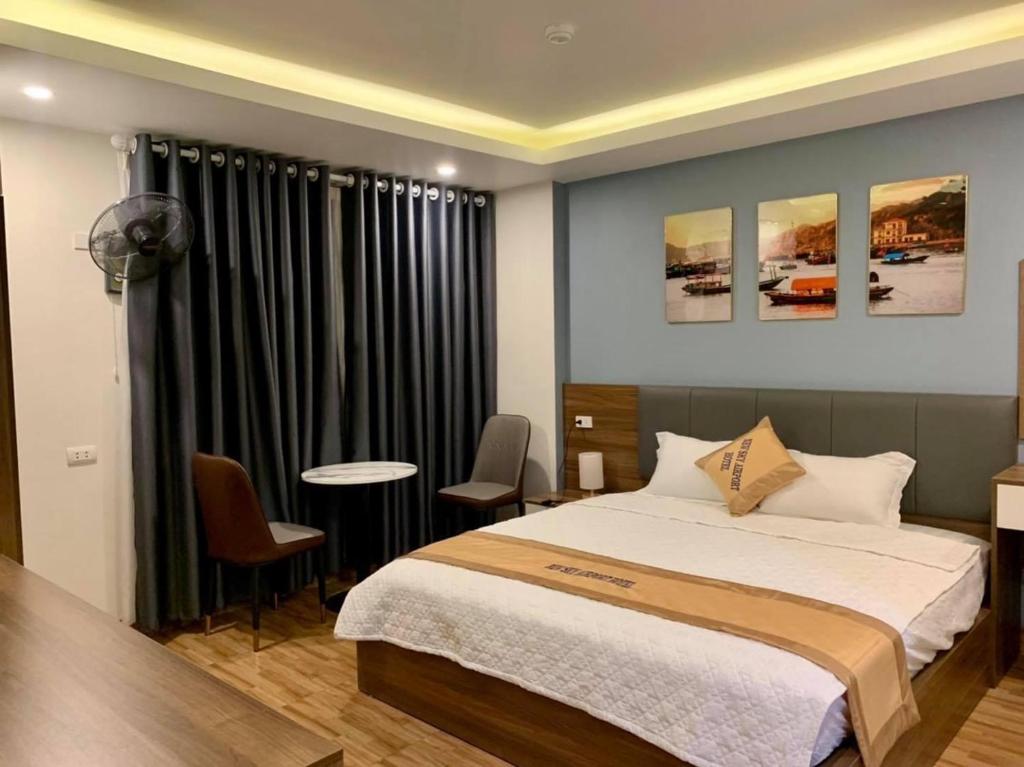 Postel nebo postele na pokoji v ubytování NEW SKY AIRPORT HOTEL NỘI BÀI