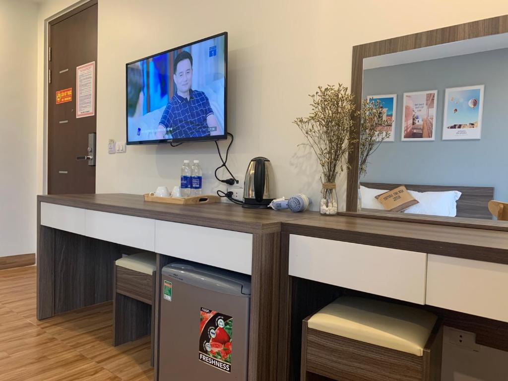 TV a/nebo společenská místnost v ubytování NEW SKY AIRPORT HOTEL NỘI BÀI