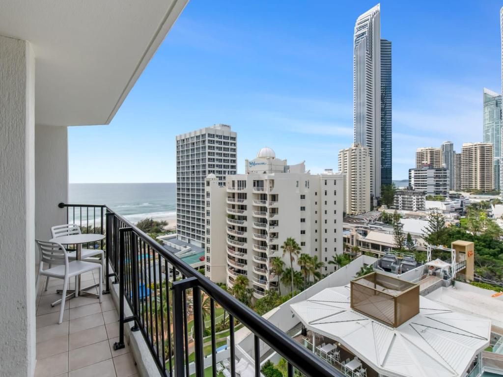 a balcony with a view of the ocean and buildings at Amazing suite with beach views at prime location in Gold Coast