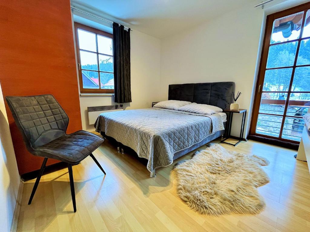 Postel nebo postele na pokoji v ubytování Apartmány Říčky III.