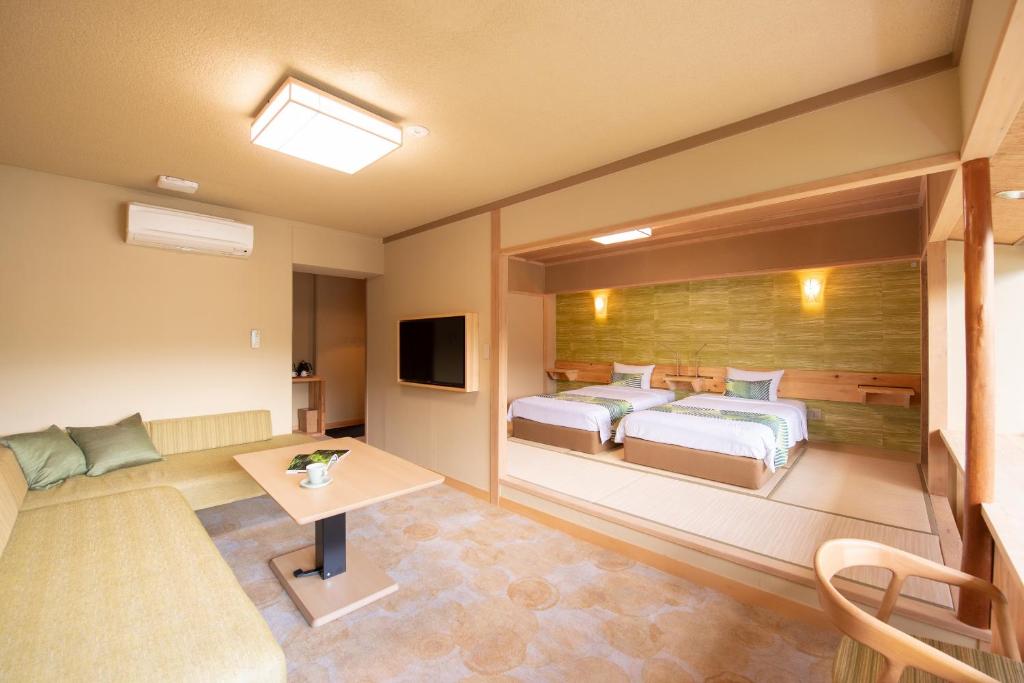 Postel nebo postele na pokoji v ubytování Fuji Lake Hotel