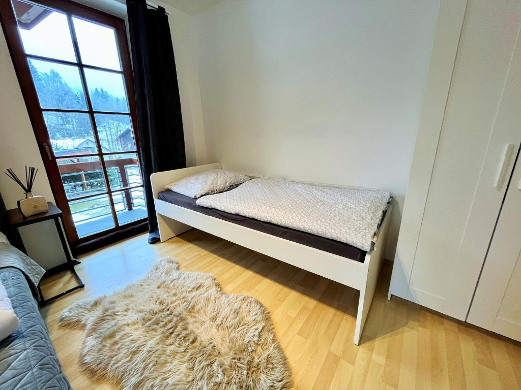 Postel nebo postele na pokoji v ubytování Apartmány Říčky III.