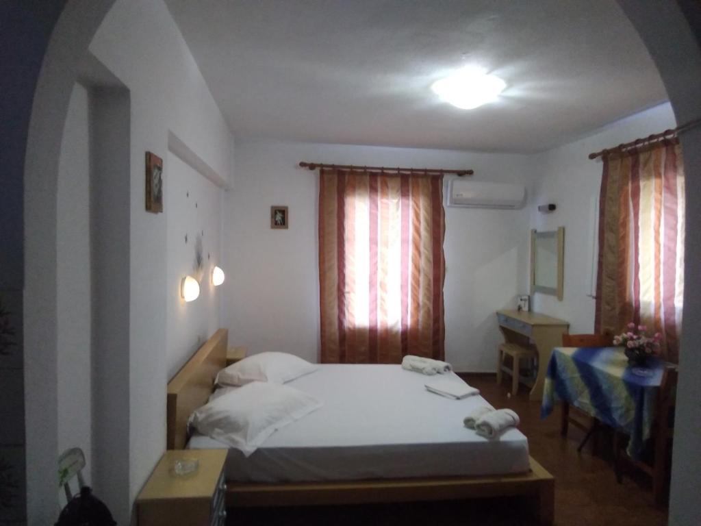 Postel nebo postele na pokoji v ubytování Villa Ourania
