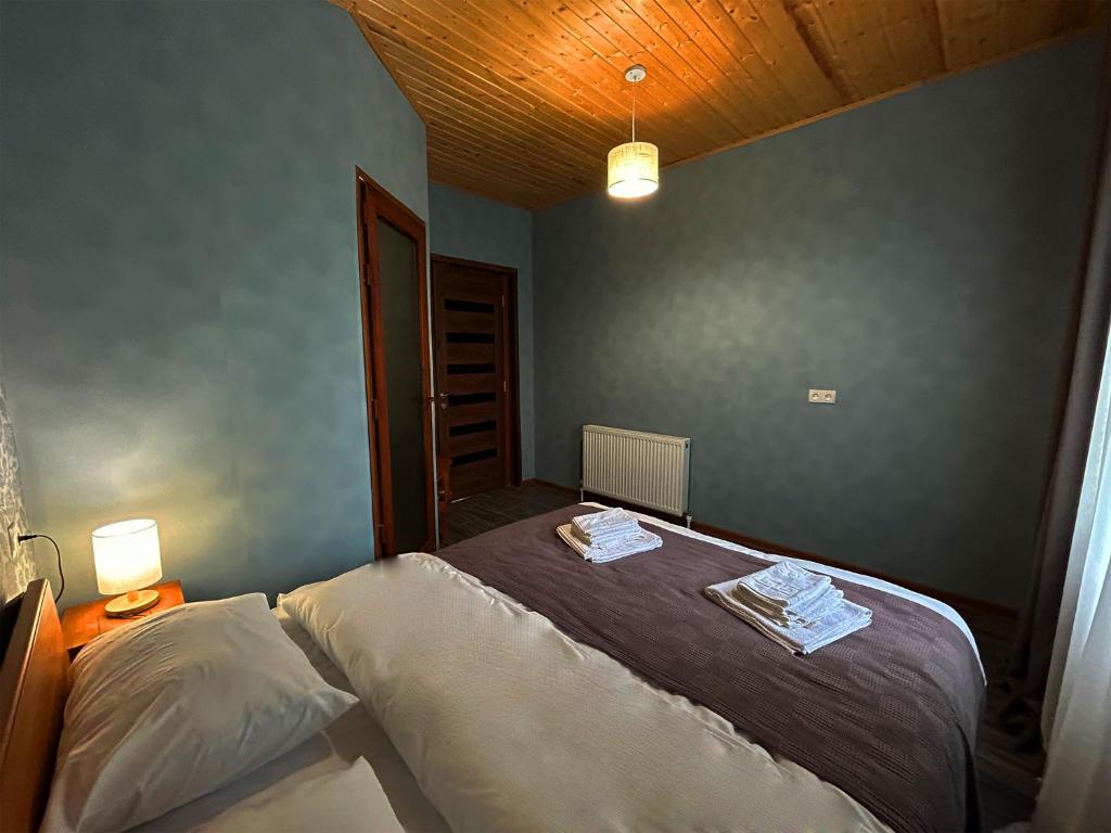 Łóżko lub łóżka w pokoju w obiekcie Hotel VIM in Sighnaghi