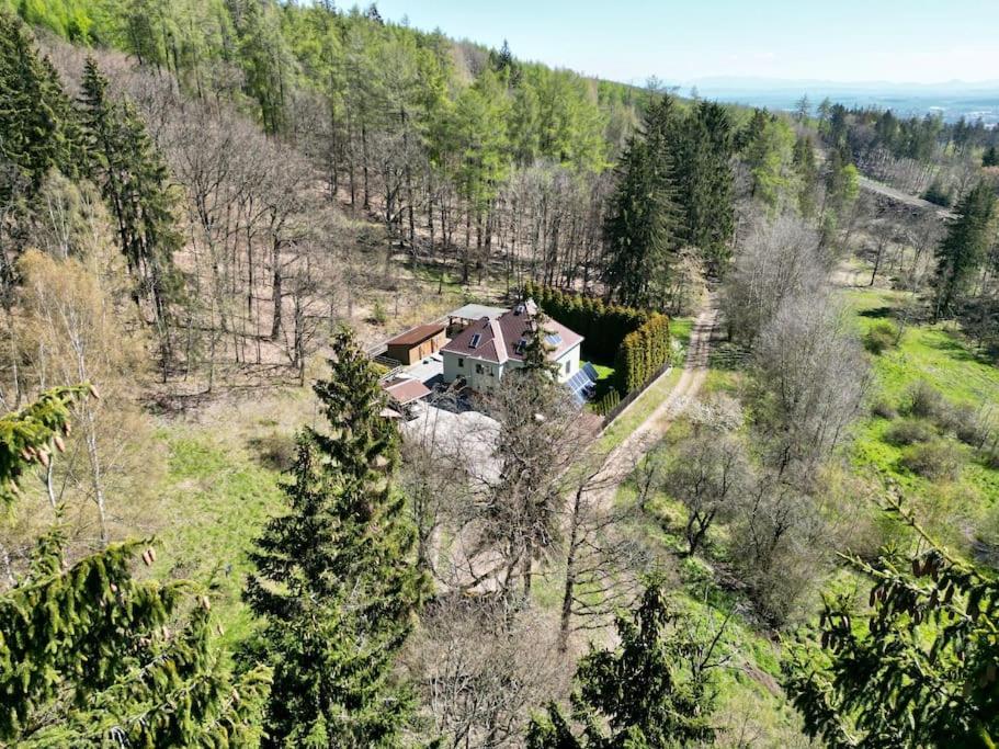 an aerial view of a house on a hill at Hunter's lodge Oliver in Křimov