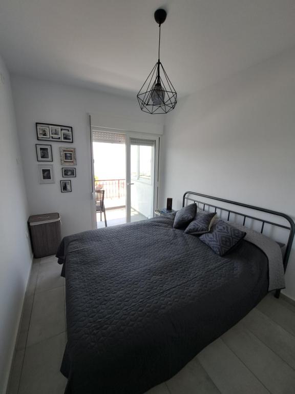 Łóżko lub łóżka w pokoju w obiekcie Perla Sea View Apartments