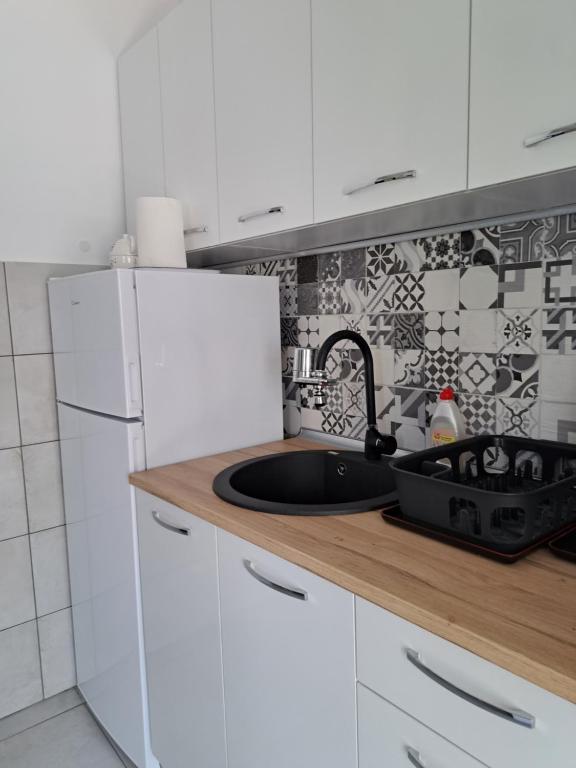 Kuchnia lub aneks kuchenny w obiekcie Perla Sea View Apartments