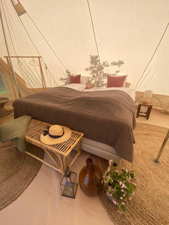 a bedroom with a bed in a tent at Green Glamping in Sønderborg