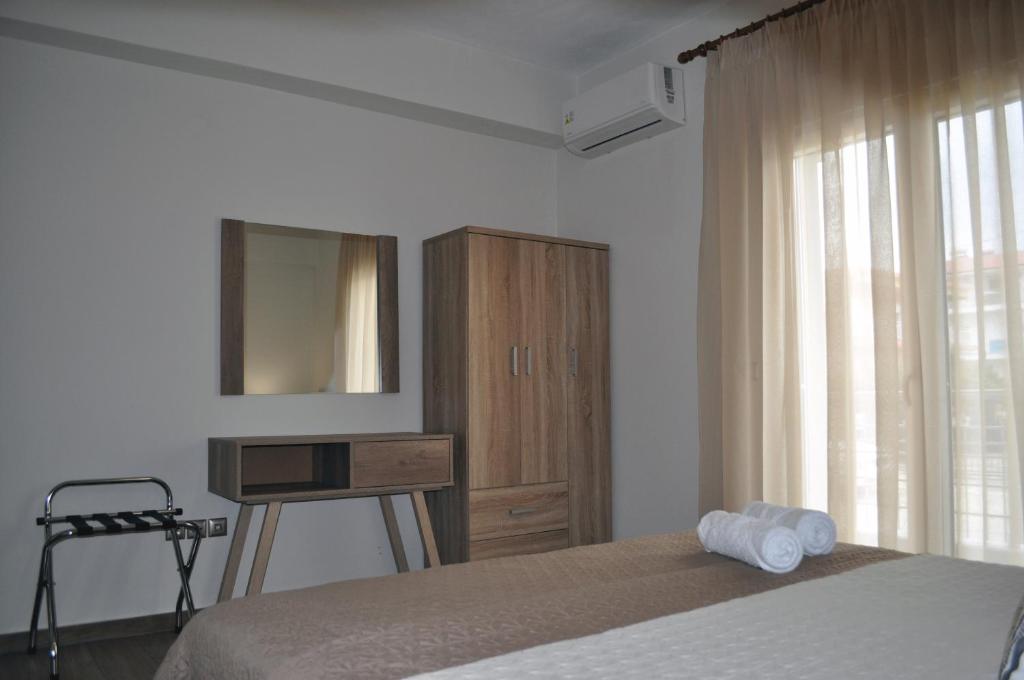 Postel nebo postele na pokoji v ubytování Thea Home
