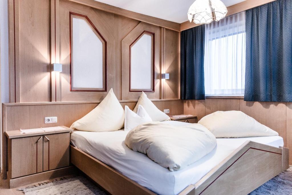 Postel nebo postele na pokoji v ubytování Gastehaus Agnes Gstrein