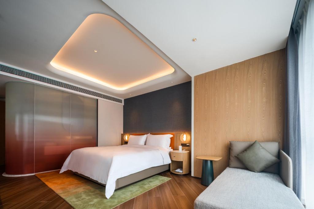 Postel nebo postele na pokoji v ubytování Jingju Hotel Shenzhen