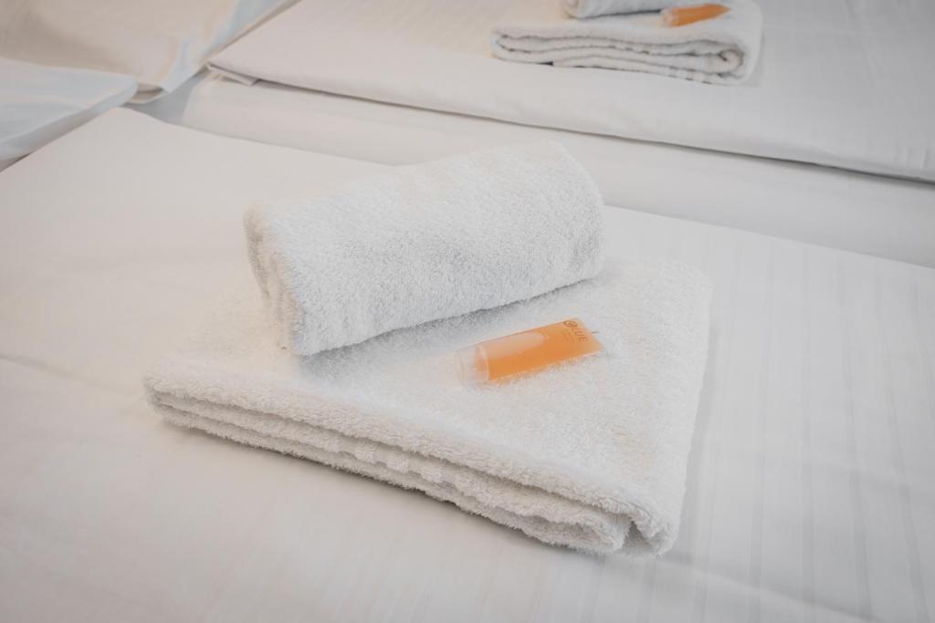 Postel nebo postele na pokoji v ubytování Self-service Hotel Ostaš Praha
