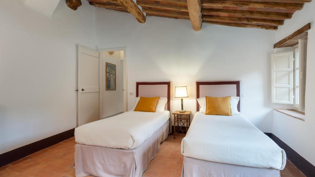 A bed or beds in a room at ANTICIANA 8, Emma Villas