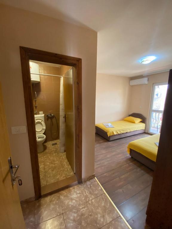 Postel nebo postele na pokoji v ubytování Apartments and Rooms Grande Casa