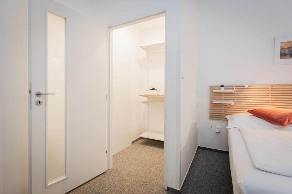 Postel nebo postele na pokoji v ubytování Self-service Hotel Ostaš Praha