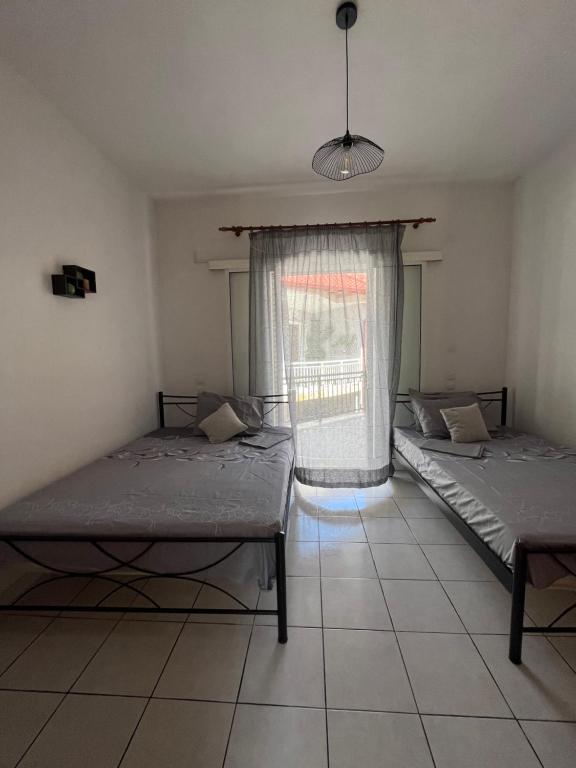 Posteľ alebo postele v izbe v ubytovaní Eleni Antonouli Rooms
