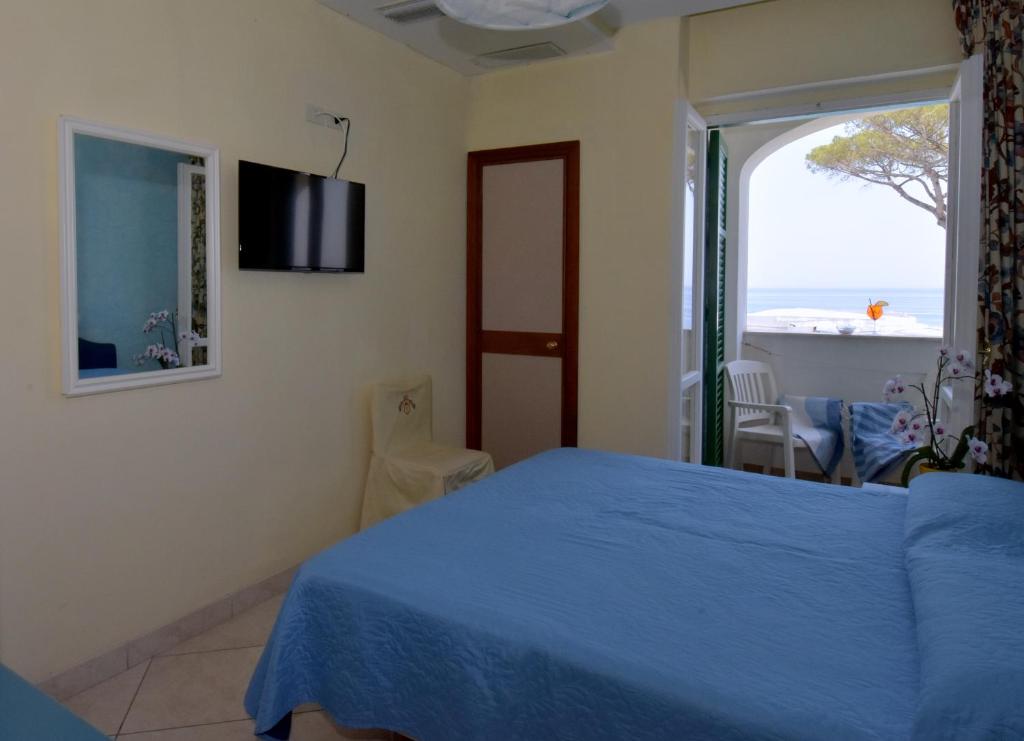 Postel nebo postele na pokoji v ubytování Hotel L'Approdo