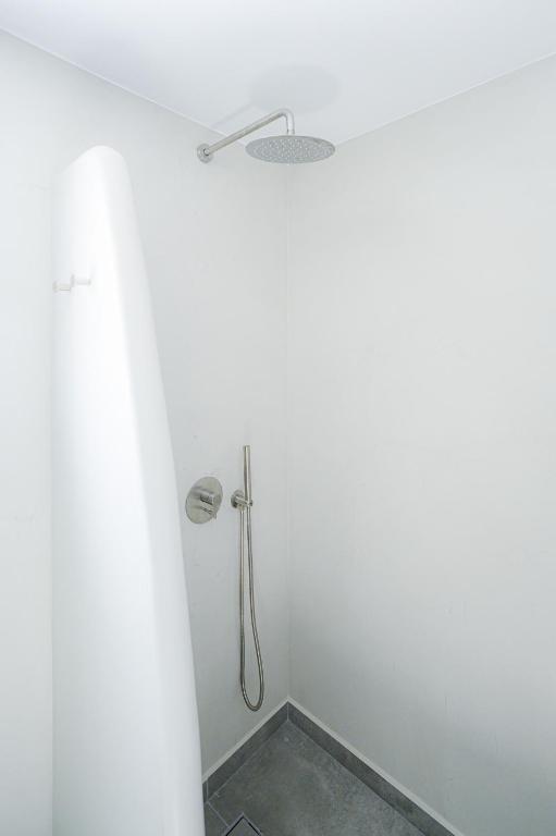 Ванная комната в Thoè Oia Suites