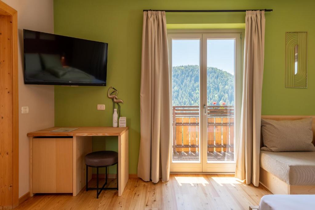 TV a/nebo společenská místnost v ubytování Villa Gottfried B&B