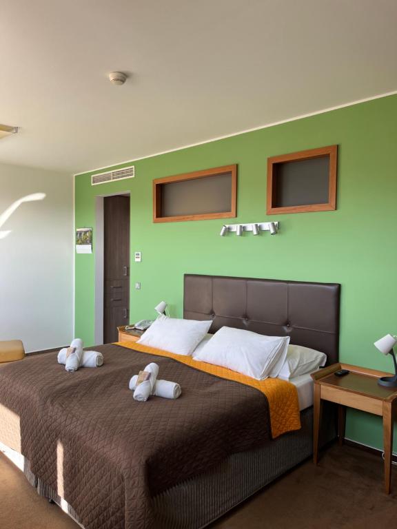 Postel nebo postele na pokoji v ubytování Hotel Beroun Golf Club