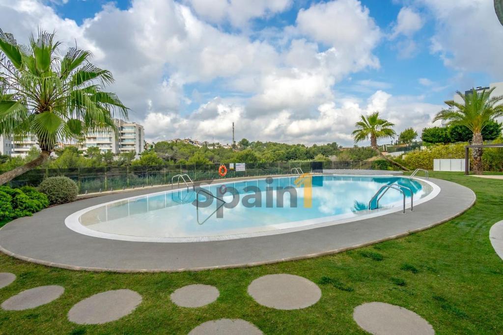 Bazén v ubytování Villamartin - Green Hills 3 Bedrooms Apartment with 3 pools, Gym, Sauna nebo v jeho okolí