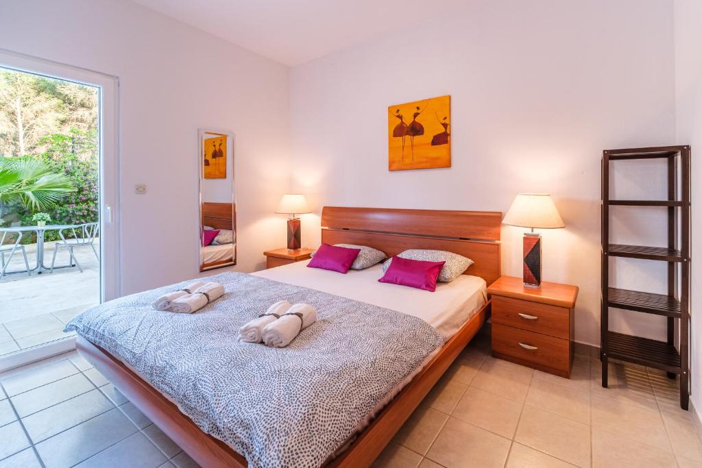 Postel nebo postele na pokoji v ubytování Apartment Elmira - Charme Holidays