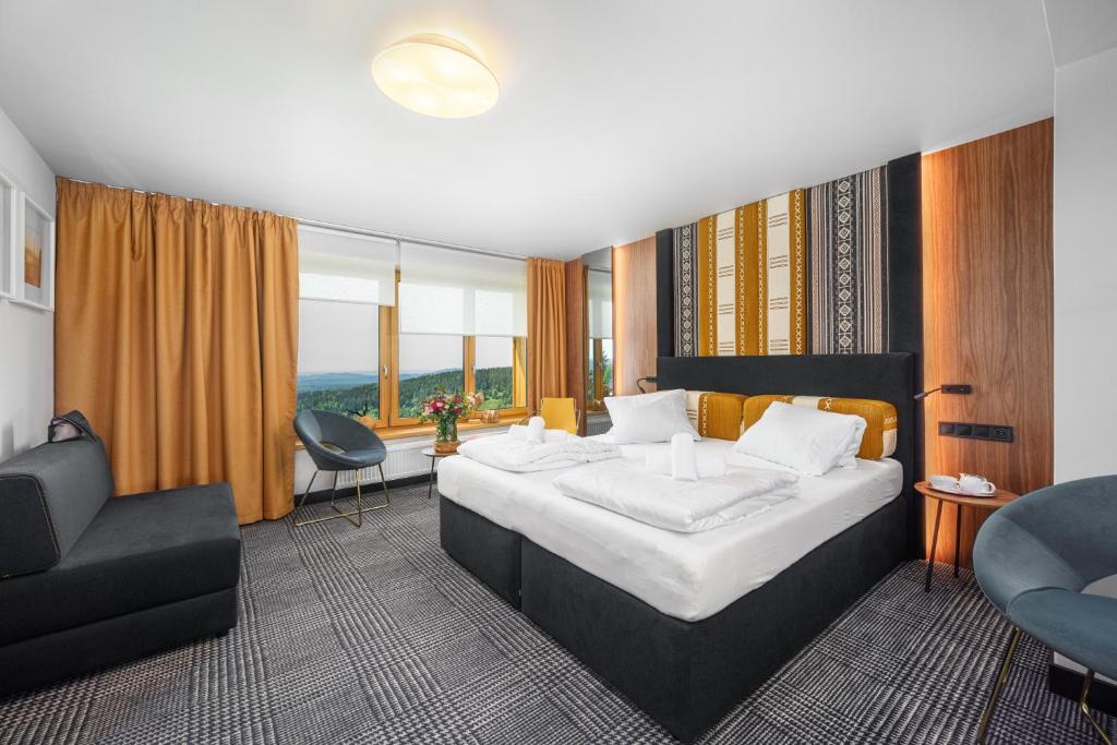 En eller flere senge i et værelse på Hotel Premier- Adults Only